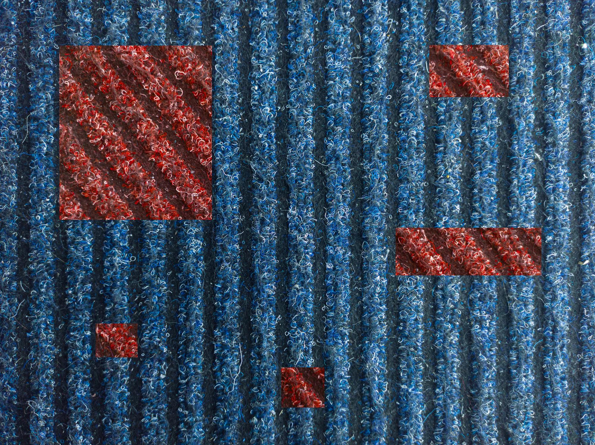 Close-up of embroidered patchwork on denim